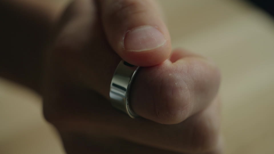 Index finger, touchpad toward your thumb.
